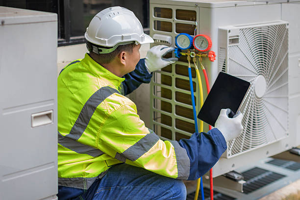 Professional Heat Pump Repair technician working in Live Oak, TX